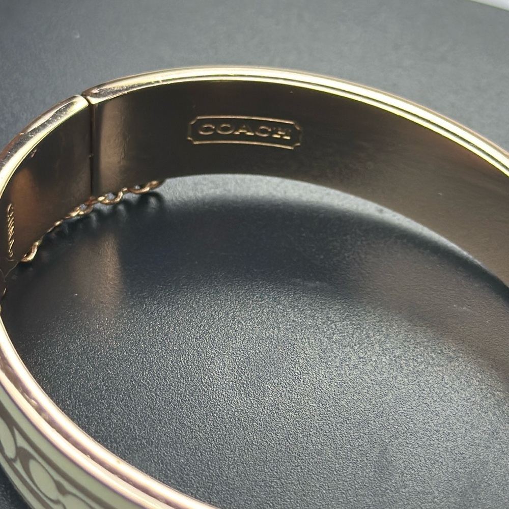 Authentic Signature Enamel Coach Bangle. Rose Tone & Cream. W/Safety Chain.